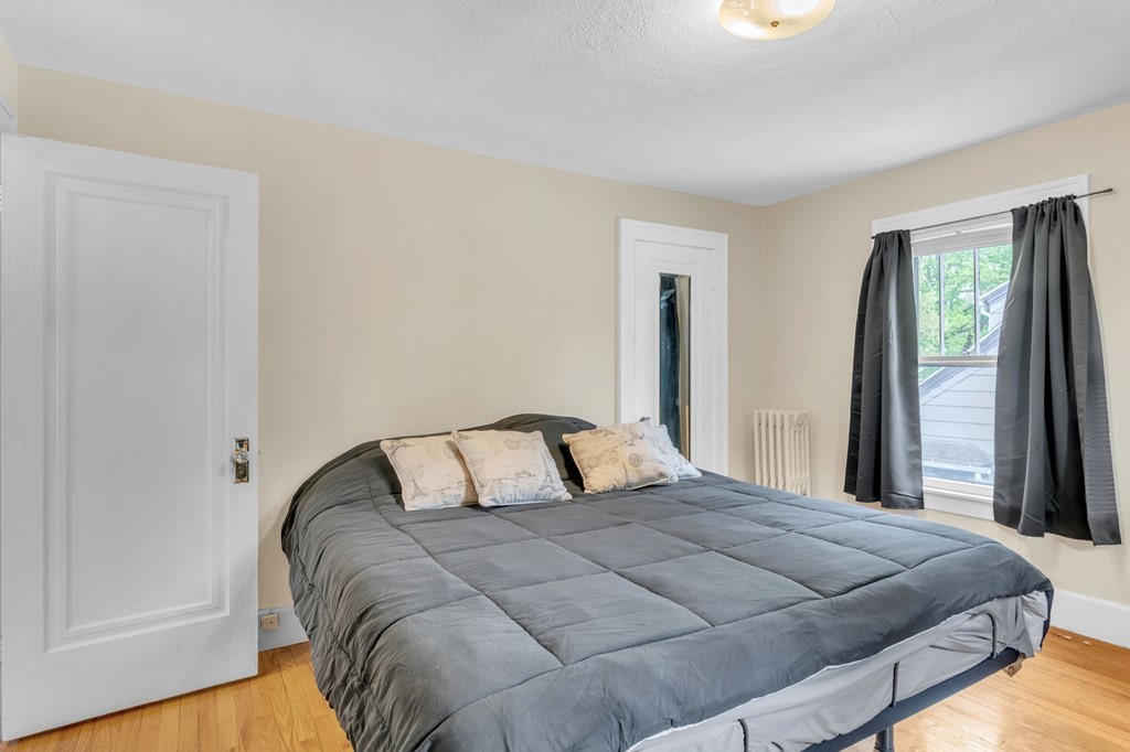 108 Manchester Terrace Springfield, MA 01108 - Photo 33 of 40 a bedroom with a bed and window