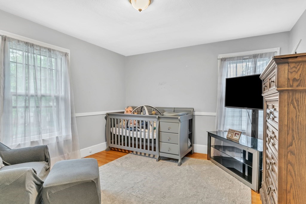 108 Manchester Terrace Springfield, MA 01108 - Photo 36 of 40 a bedroom with furniture and a window
