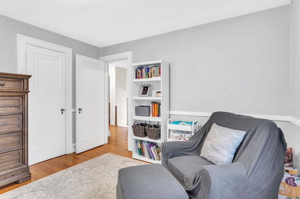 108 Manchester Terrace Springfield, MA 01108 - Photo 37 of 40 a living room with a couch and a painting on the wall