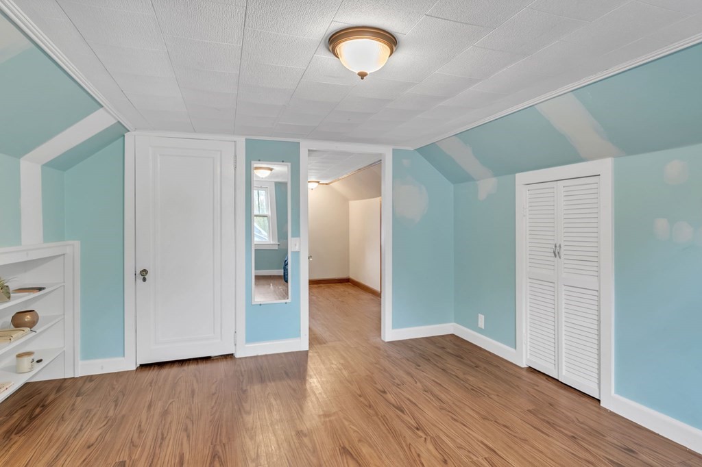 108 Manchester Terrace Springfield, MA 01108 - Photo 39 of 40 an empty room with wooden floor and windows