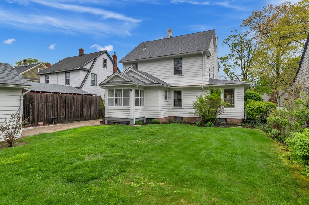 108 Manchester Terrace Springfield, MA 01108 - Photo 4 of 40 a front view of a house with a garden