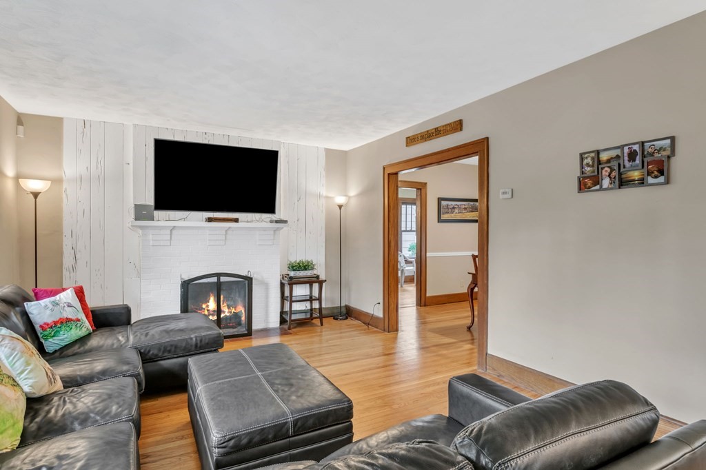 108 Manchester Terrace Springfield, MA 01108 - Photo 7 of 40 a living room with furniture or flat screen tv and a fireplace