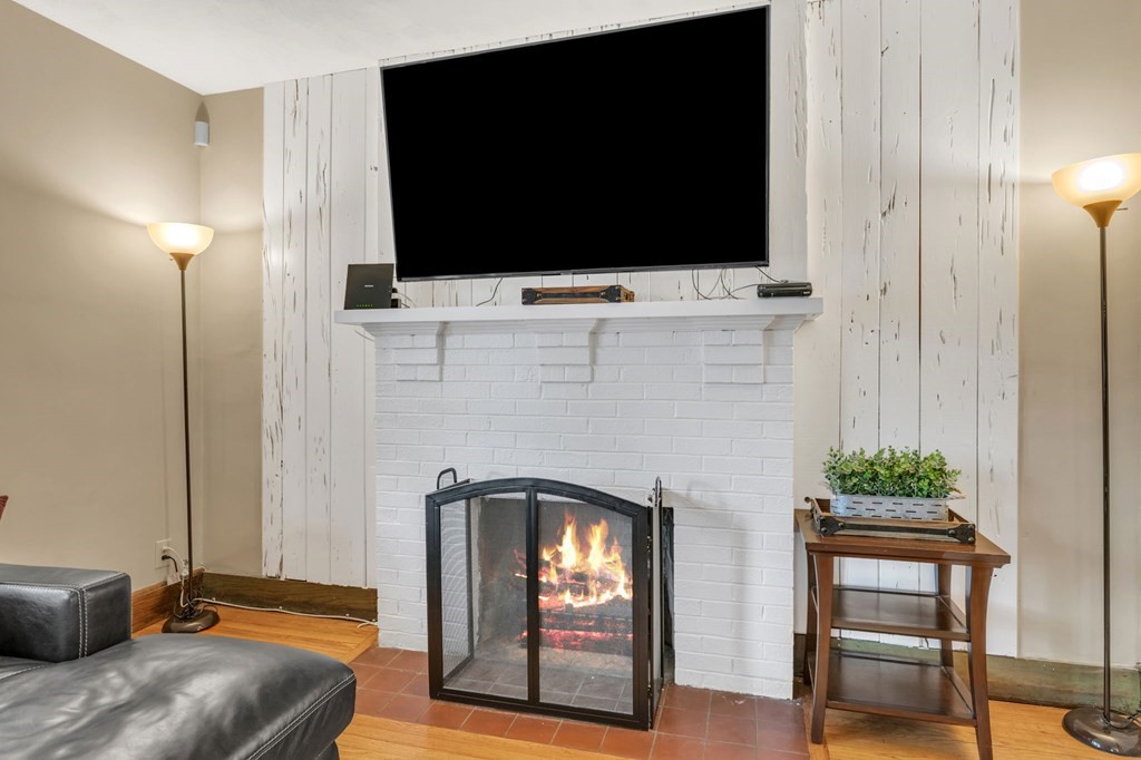 108 Manchester Terrace Springfield, MA 01108 - Photo 10 of 40 a living room with furniture and a flat screen tv