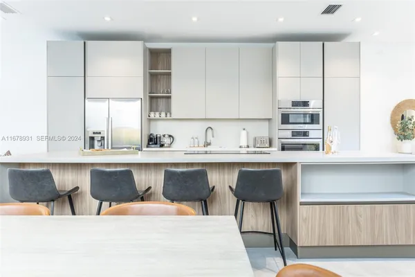 a bathroom with a walk in closet and a window