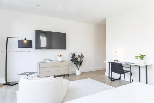 a view of outdoor kitchen with seating area