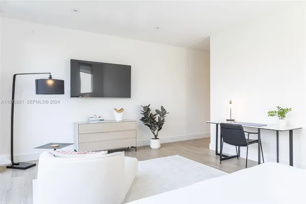 a view of outdoor kitchen with seating area