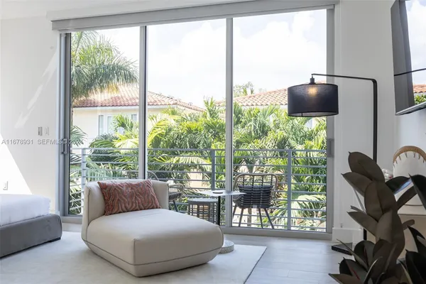 a view of balcony with furniture
