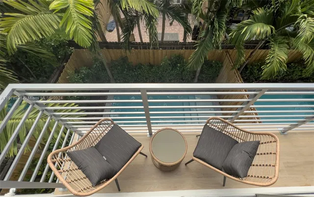 a bathroom with a shower sink and mirror