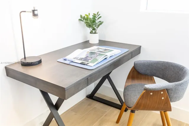 a view of a living room and kitchen with furniture