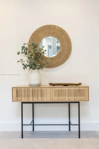 a living room with furniture a lamp and a table