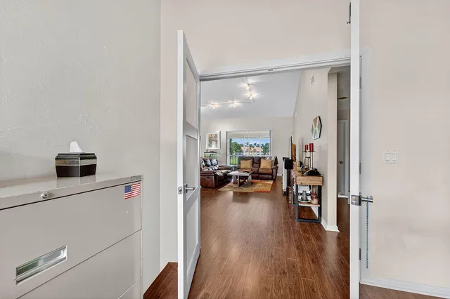 a view of a dining room with furniture and wooden floor