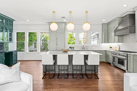 a kitchen with cabinets and stainless steel appliances