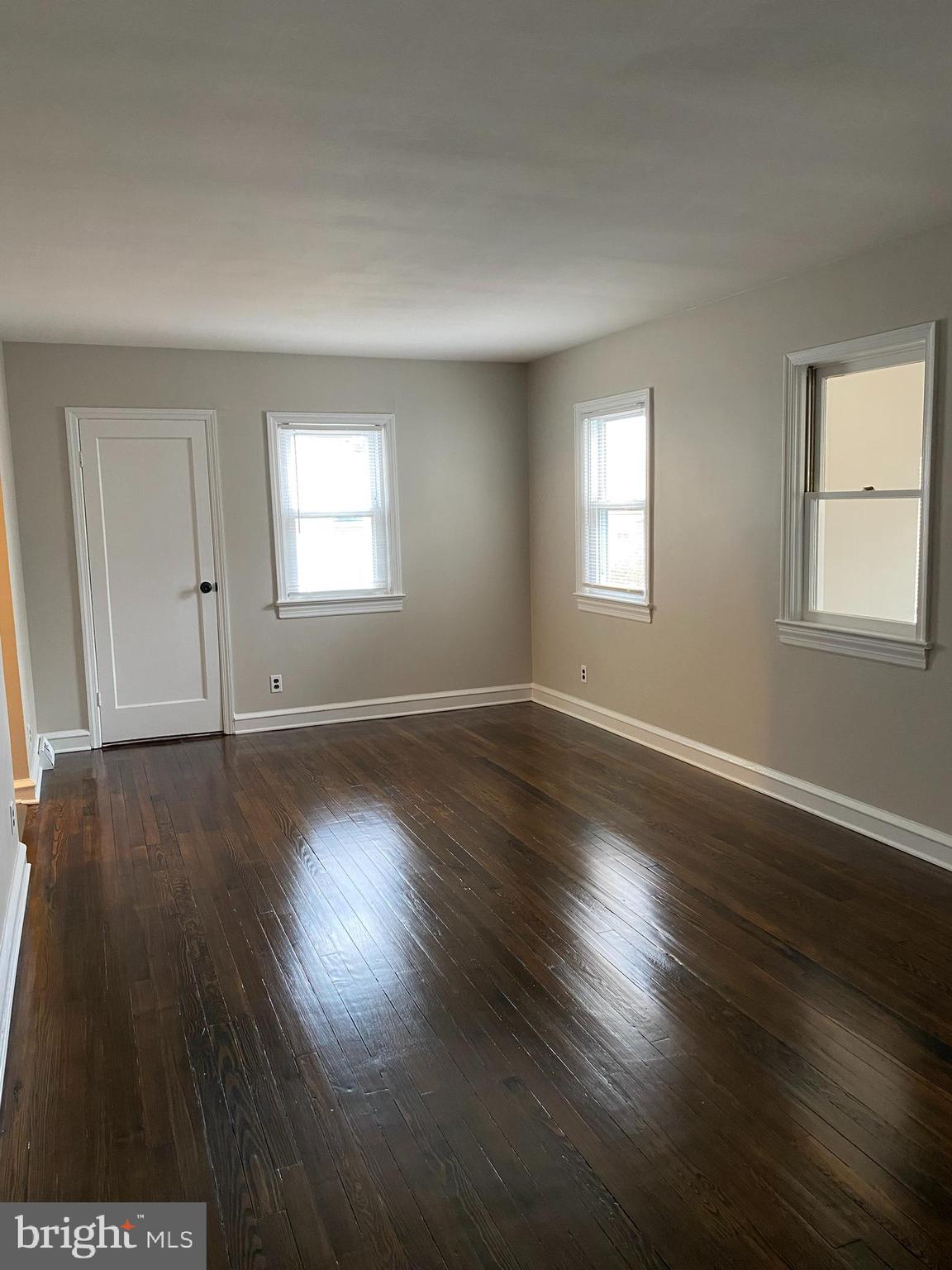 258 Birch Street Penns Grove, NJ 08069 - Photo 12 of 41 an empty room with wooden floor and windows
