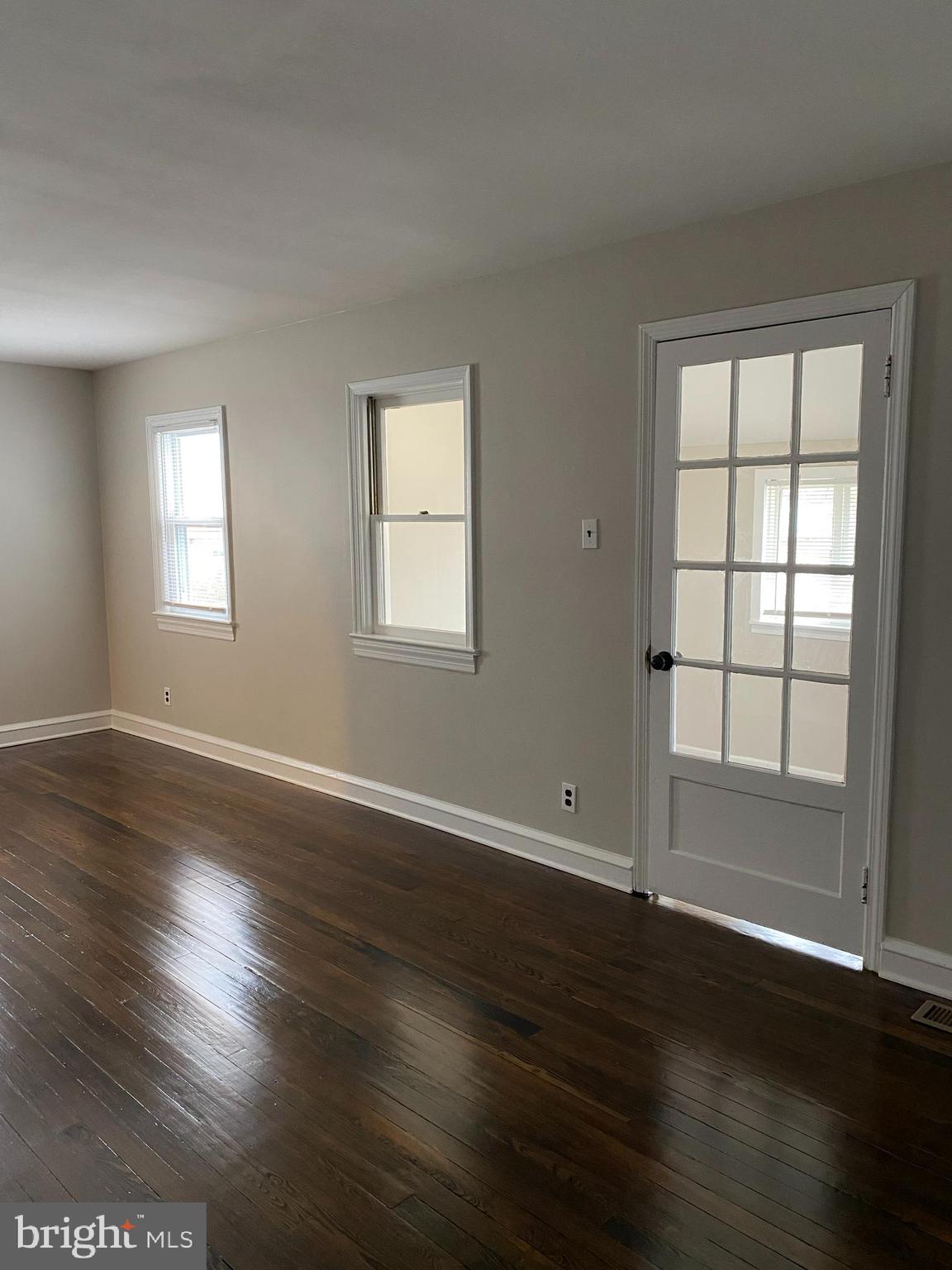258 Birch Street Penns Grove, NJ 08069 - Photo 13 of 41 an empty room with wooden floor and windows