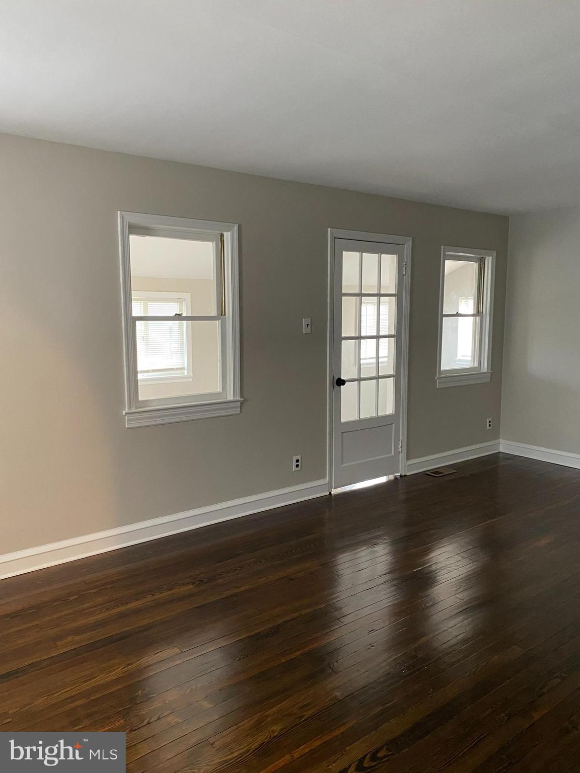 258 Birch Street Penns Grove, NJ 08069 - Photo 14 of 41 an empty room with wooden floor and windows