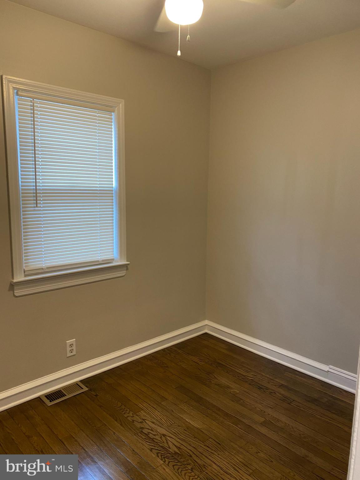 258 Birch Street Penns Grove, NJ 08069 - Photo 27 of 41 a view of an empty room with wooden floor and a window