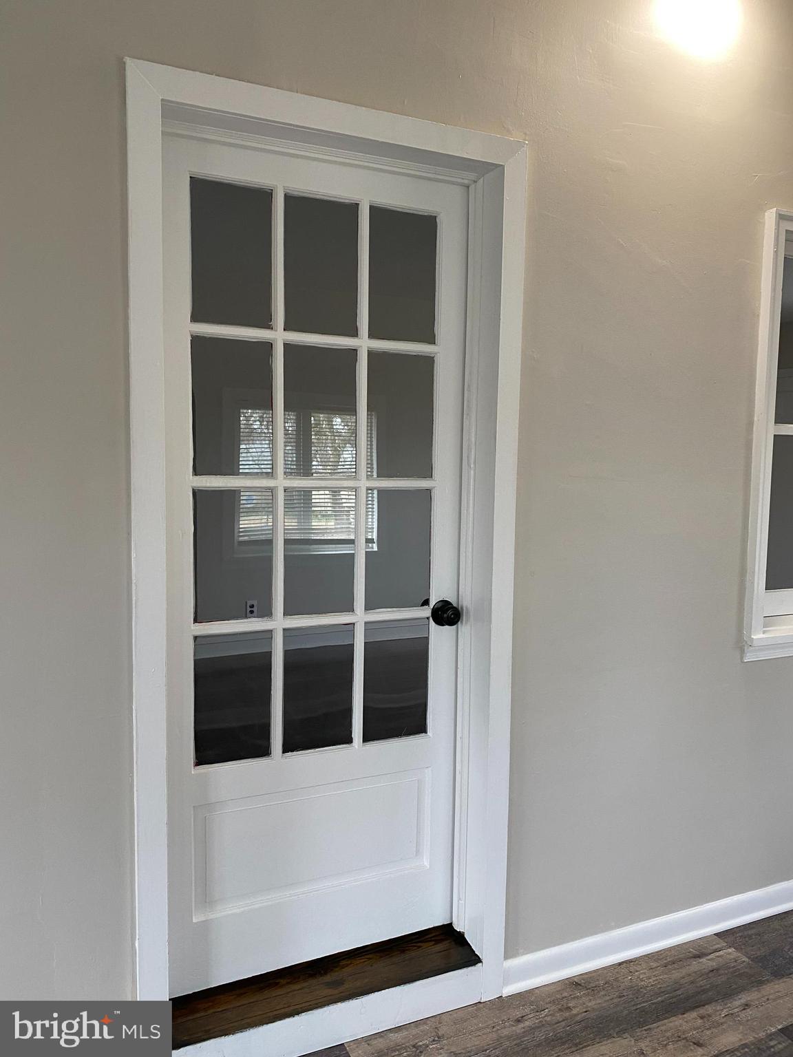 258 Birch Street Penns Grove, NJ 08069 - Photo 10 of 41 a view of an empty room with wooden floor and a window