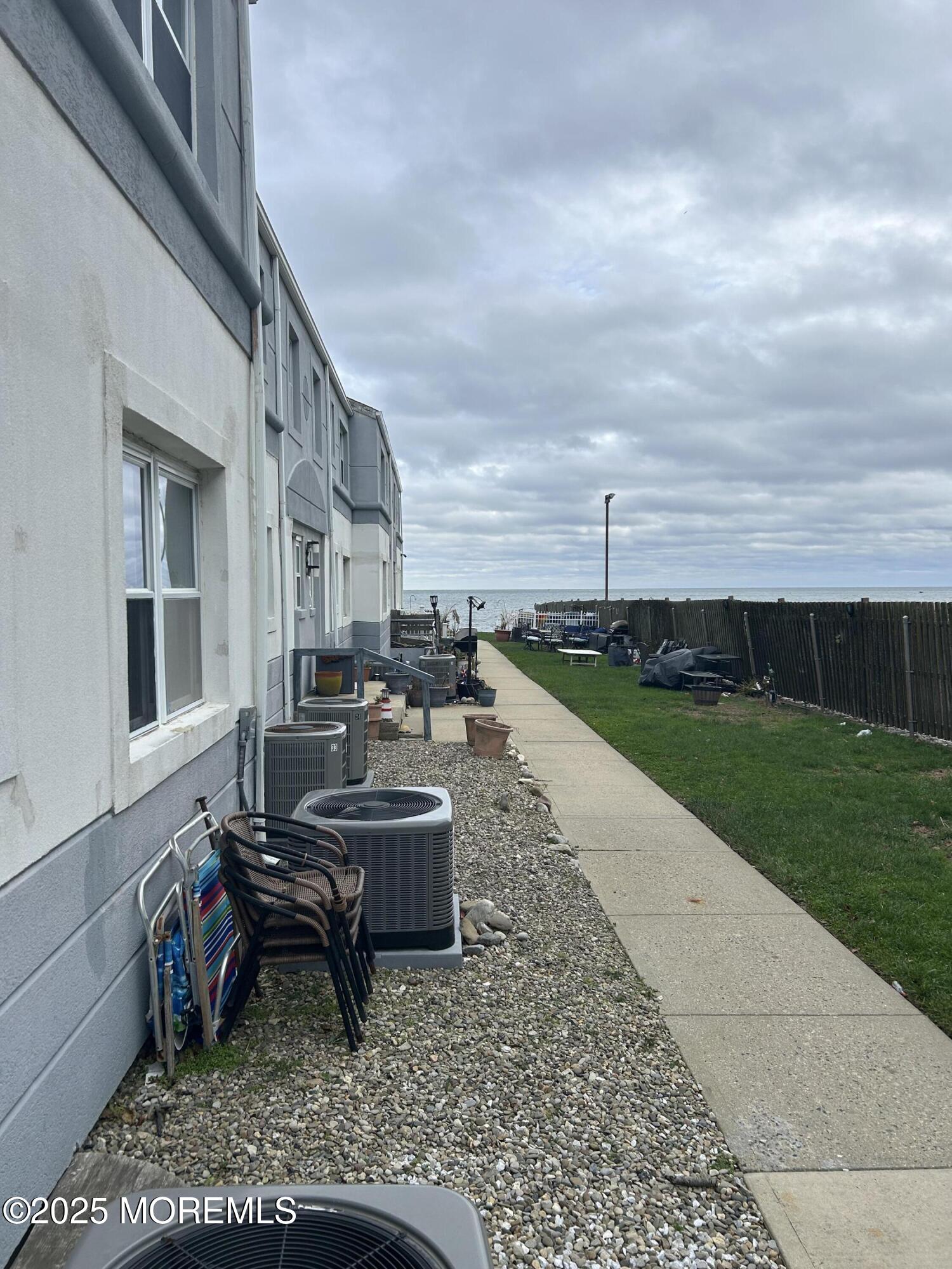 661 Ocean Avenue, Unit 31 Long Branch, NJ 07740 - Photo 11 of 12 a view of a house with backyard porch and sitting area