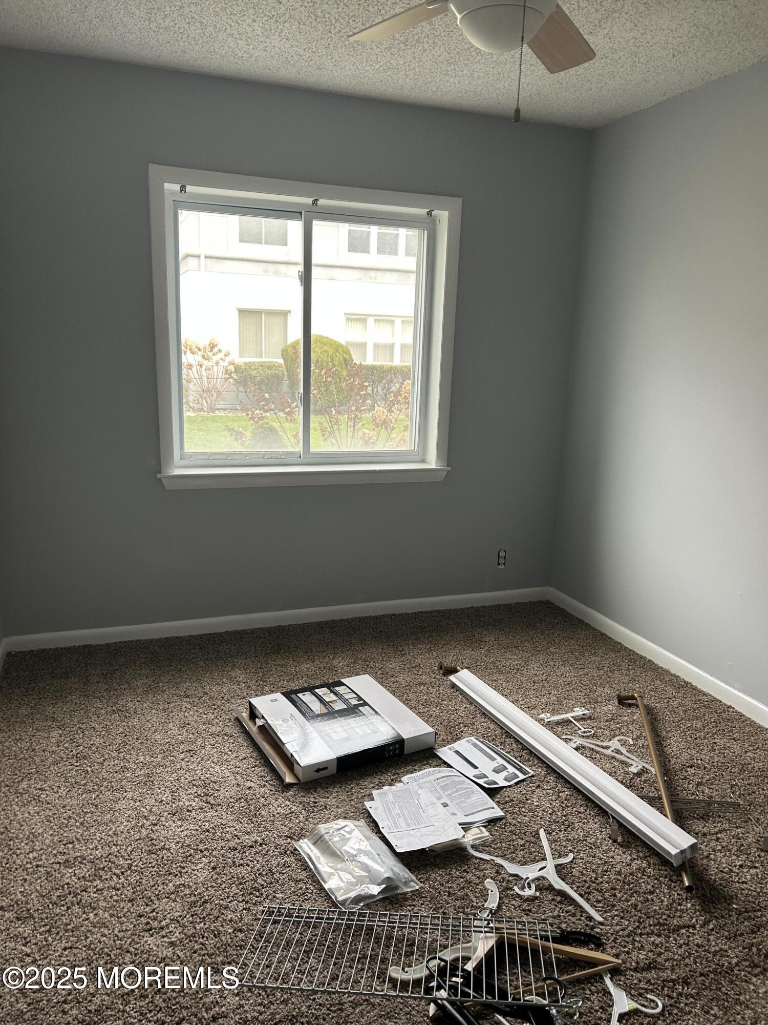 661 Ocean Avenue, Unit 31 Long Branch, NJ 07740 - Photo 6 of 12 a bed sitting in a bedroom next to a window