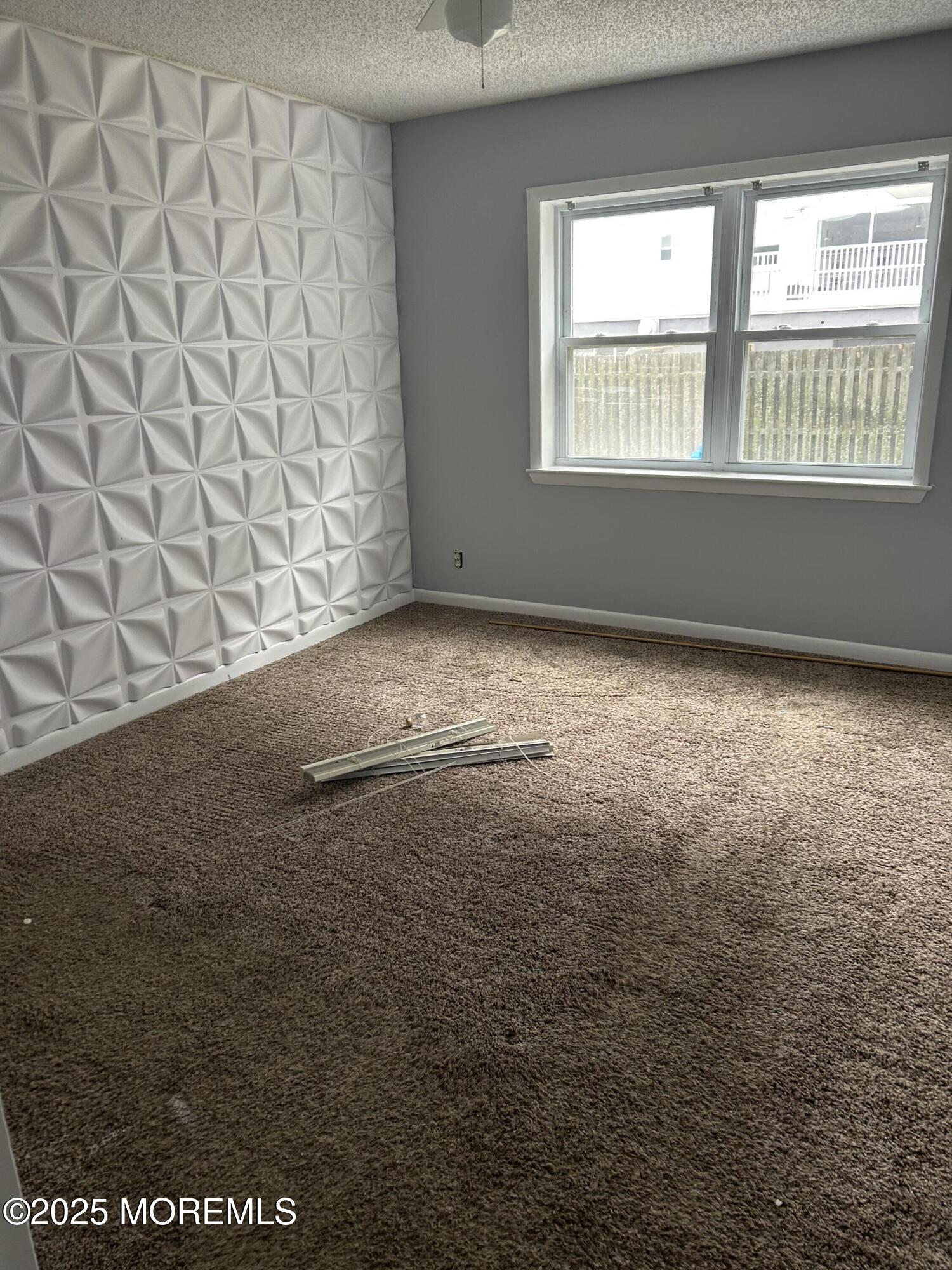 661 Ocean Avenue, Unit 31 Long Branch, NJ 07740 - Photo 9 of 12 a view of empty room with window