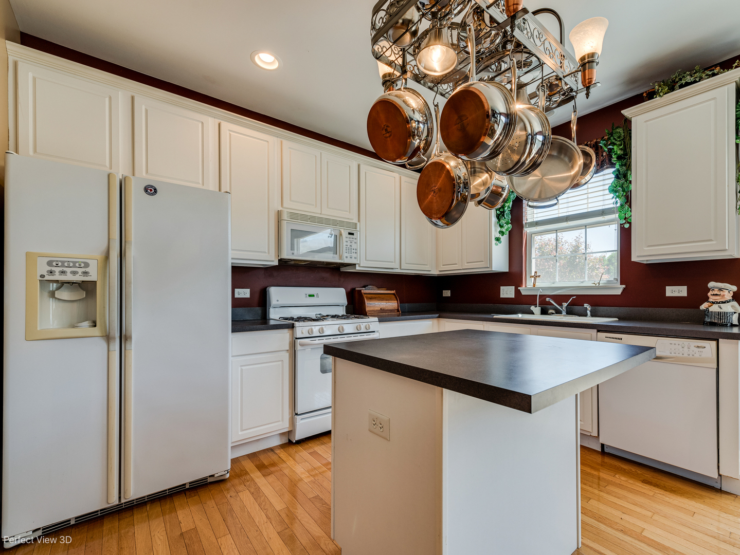 1606 Creekside Circle Minooka, IL 60447 - Photo 5 of 30 a kitchen with stainless steel appliances granite countertop a sink a stove and a refrigerator