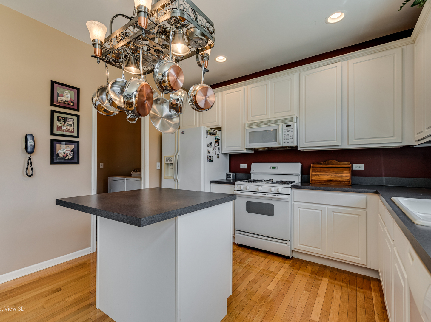 1606 Creekside Circle Minooka, IL 60447 - Photo 6 of 30 a kitchen with stainless steel appliances granite countertop a sink cabinets and wooden floor