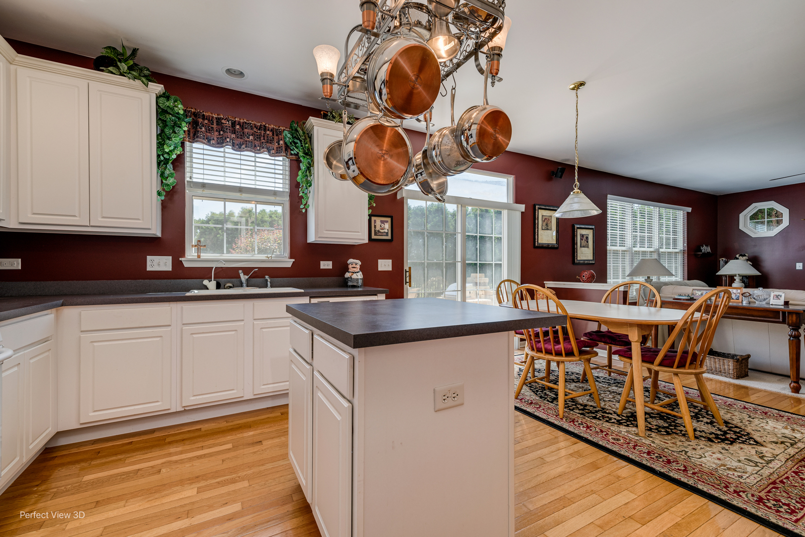1606 Creekside Circle Minooka, IL 60447 - Photo 8 of 30 a kitchen with a sink cabinets and wooden floor