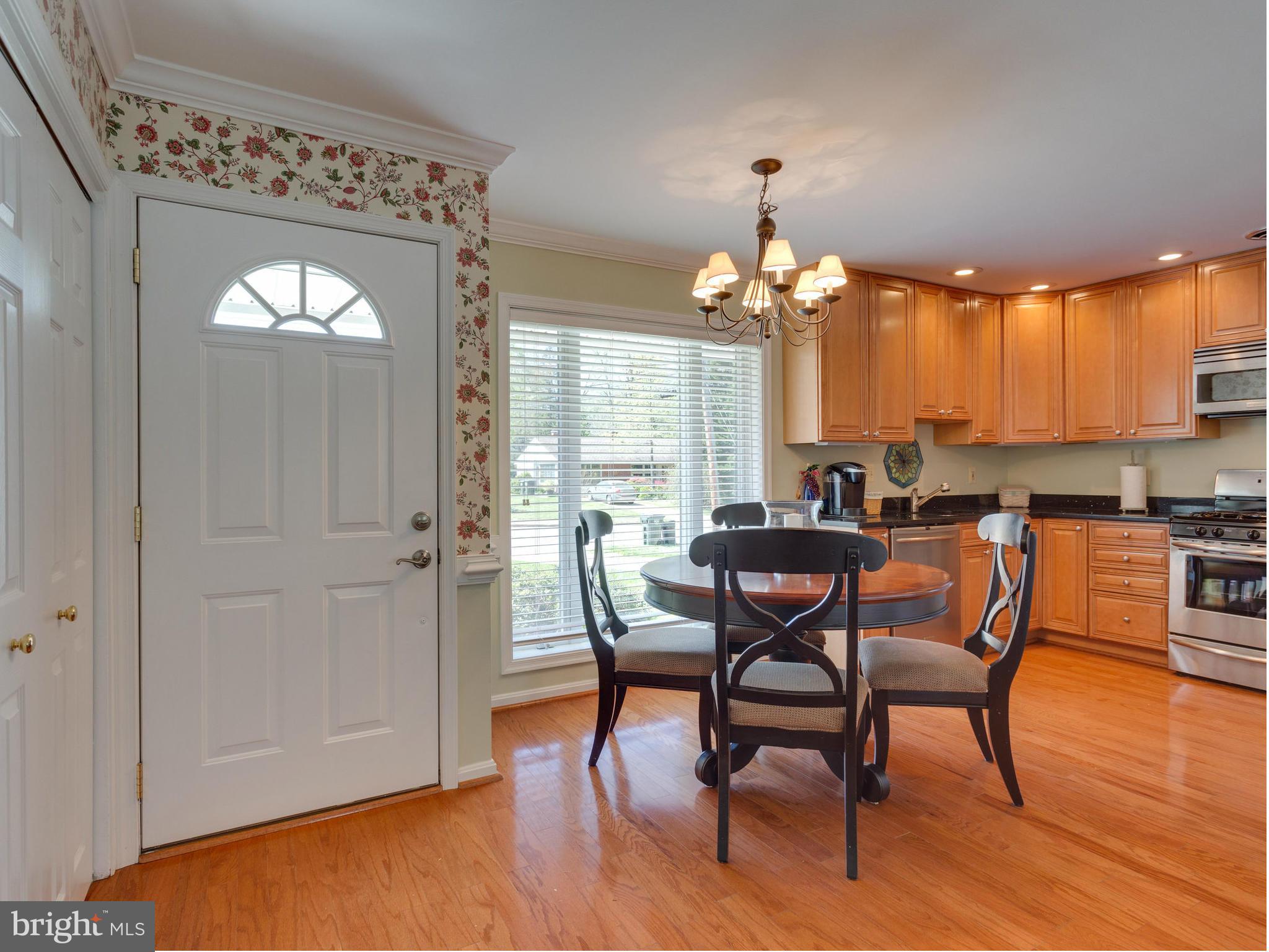 5218 Garner Street Springfield, VA 22151 - Photo 2 of 29 a view of a dining room with furniture and wooden floor