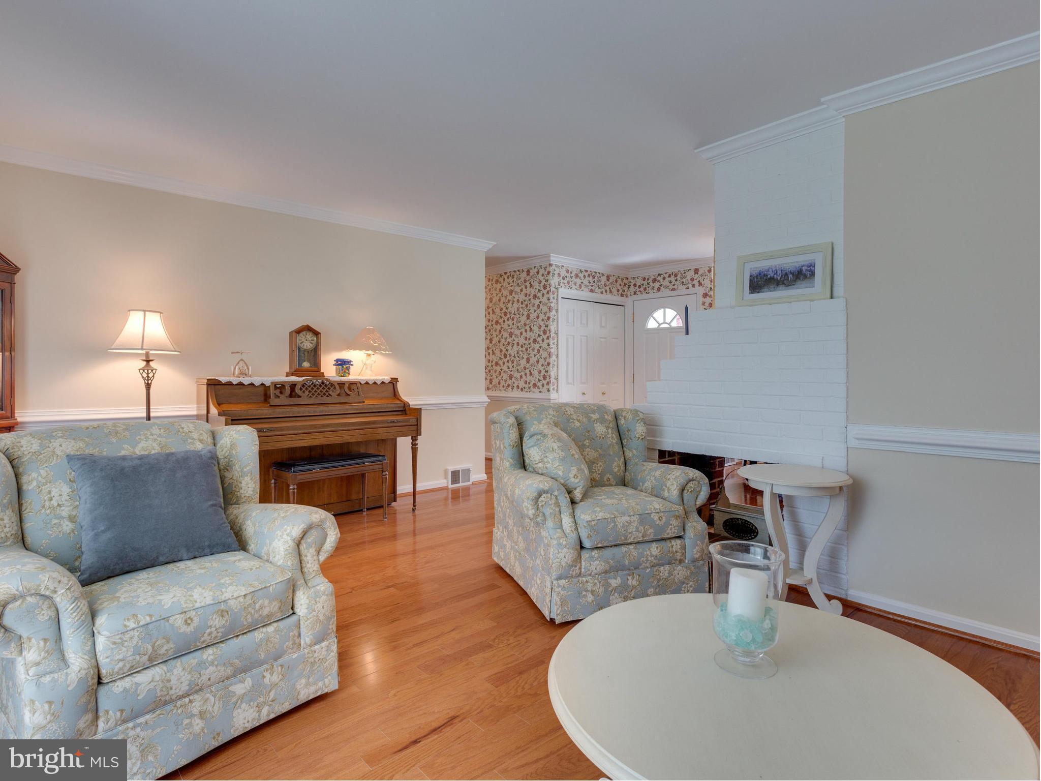 5218 Garner Street Springfield, VA 22151 - Photo 12 of 29 a living room with furniture and a lamp