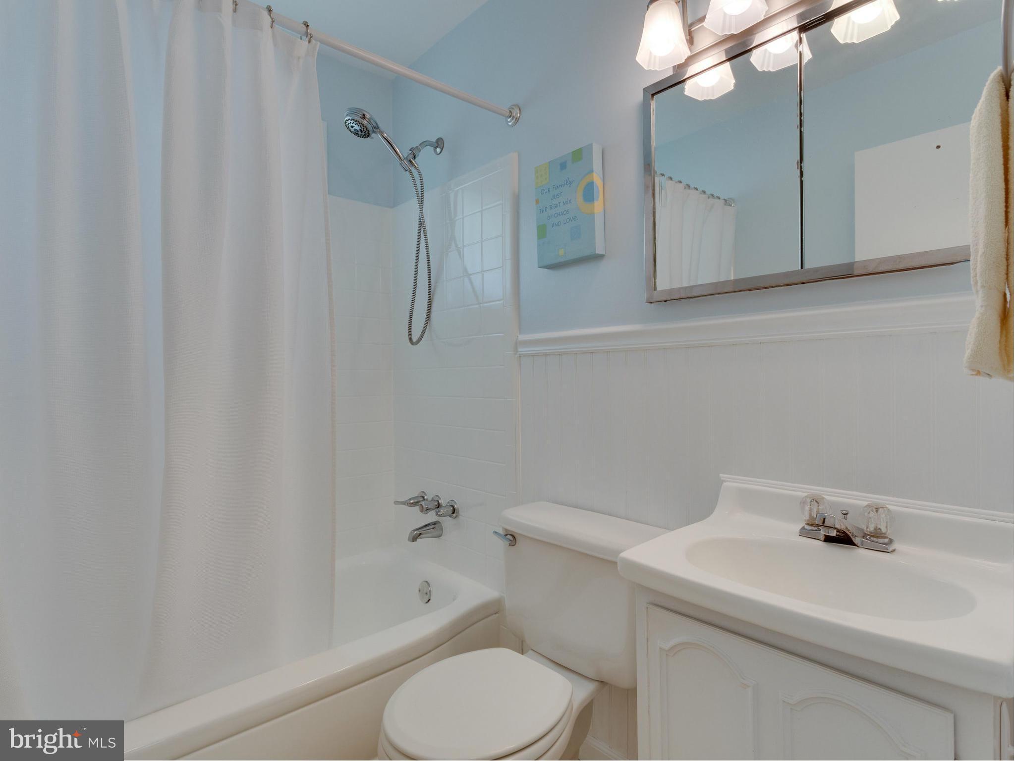 5218 Garner Street Springfield, VA 22151 - Photo 15 of 29 a bathroom with a sink a toilet and shower