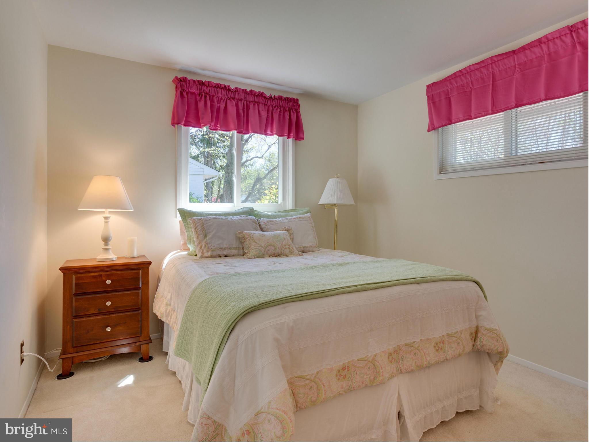 5218 Garner Street Springfield, VA 22151 - Photo 16 of 29 a bedroom with a bed and a window
