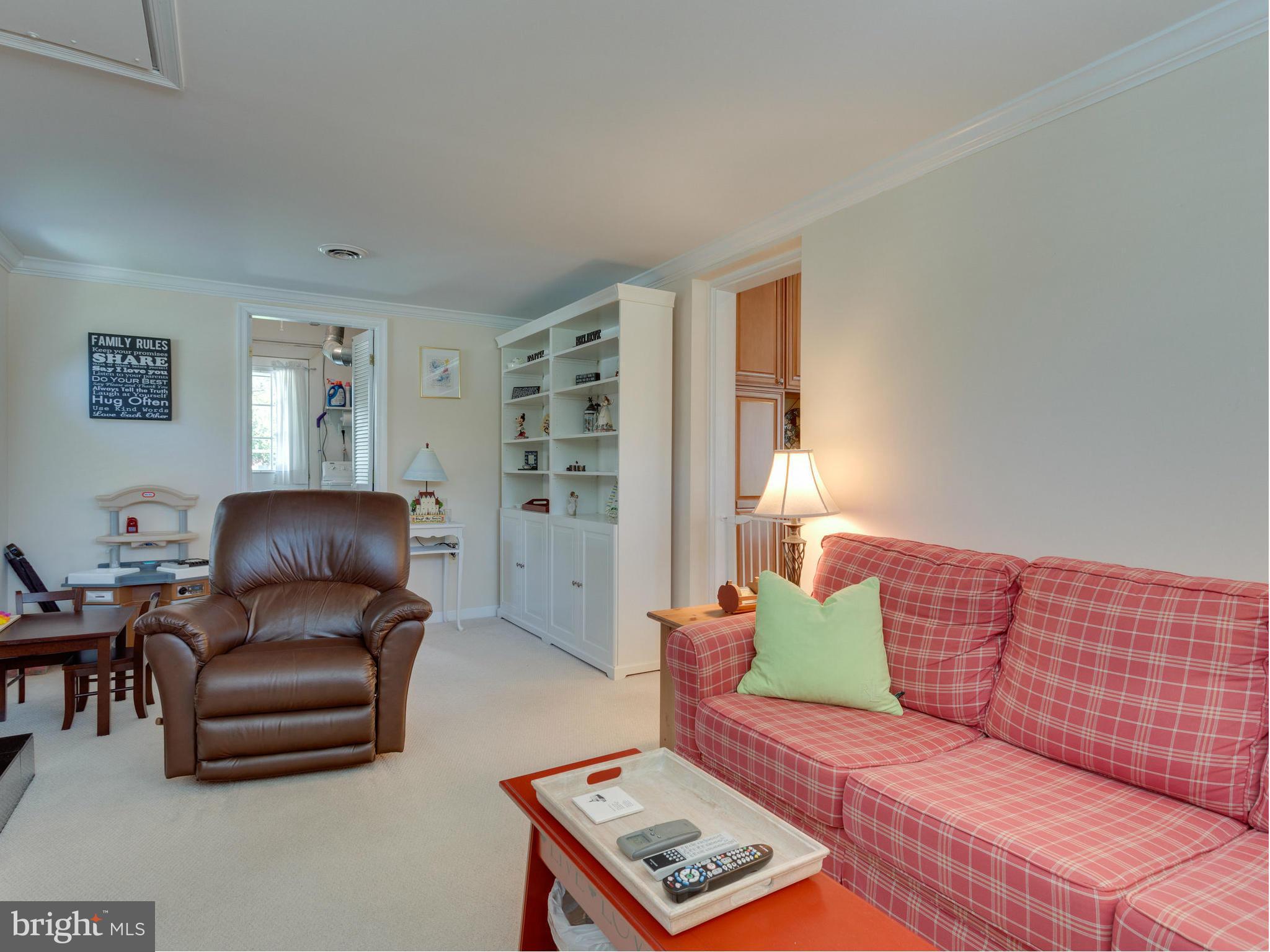 5218 Garner Street Springfield, VA 22151 - Photo 20 of 29 a living room with furniture and a lamp