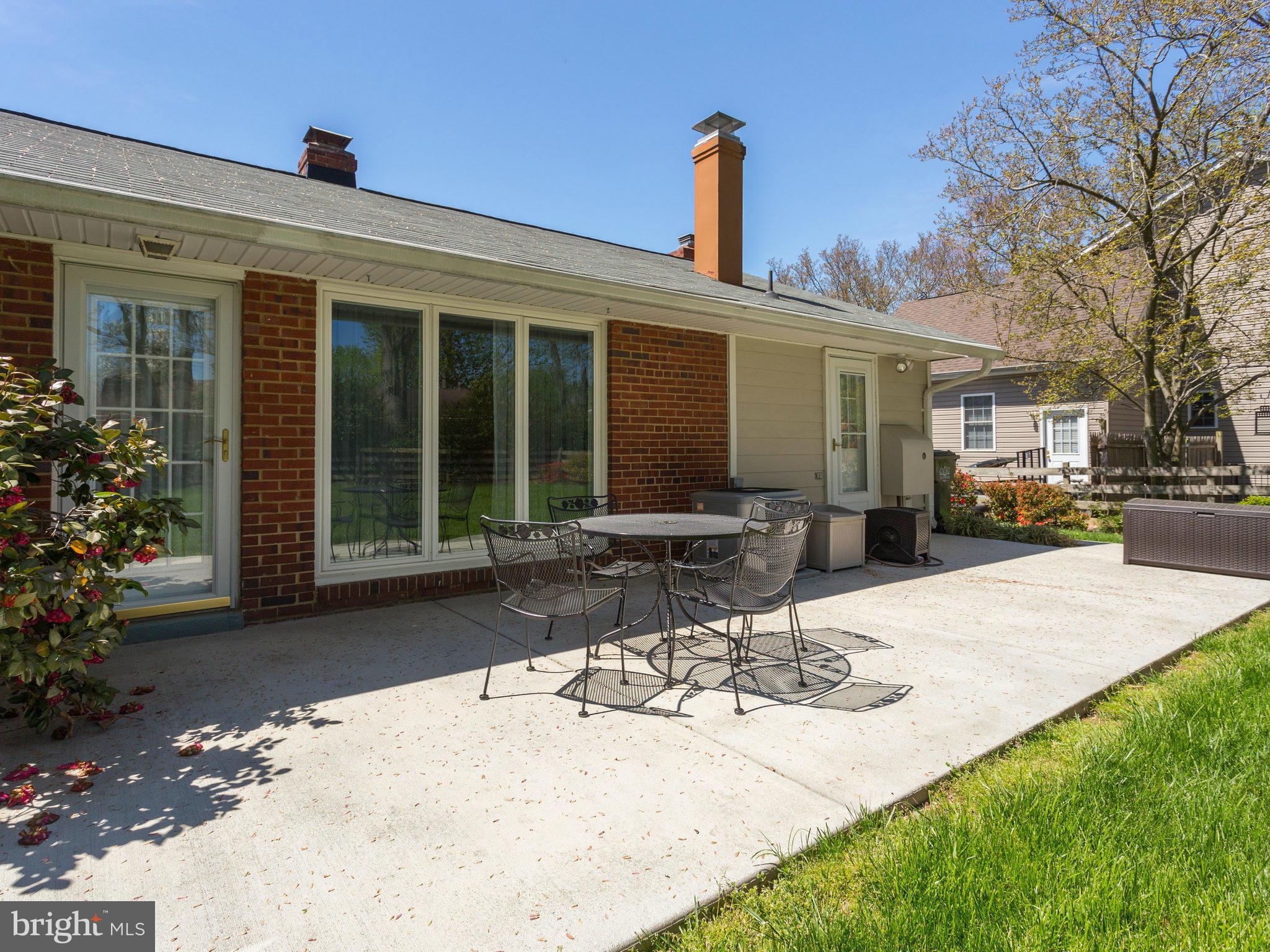5218 Garner Street Springfield, VA 22151 - Photo 22 of 29 a view of a patio with table and chairs and potted plants