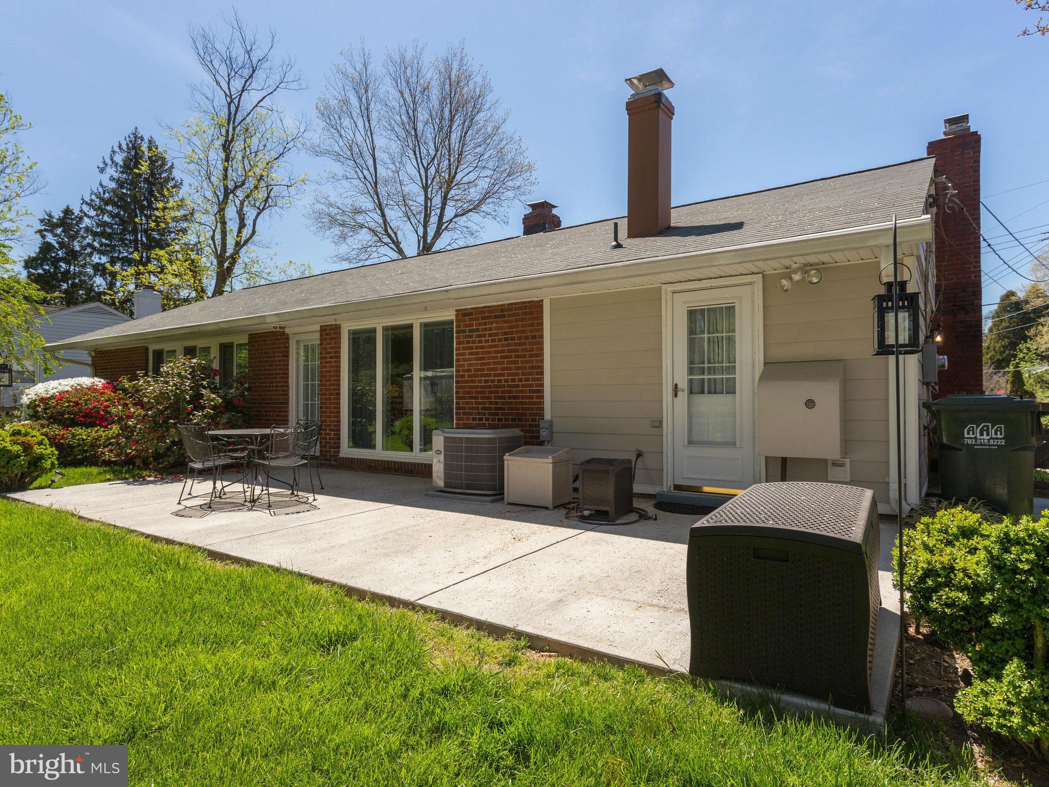 5218 Garner Street Springfield, VA 22151 - Photo 23 of 29 a front view of house with yard outdoor seating and green space