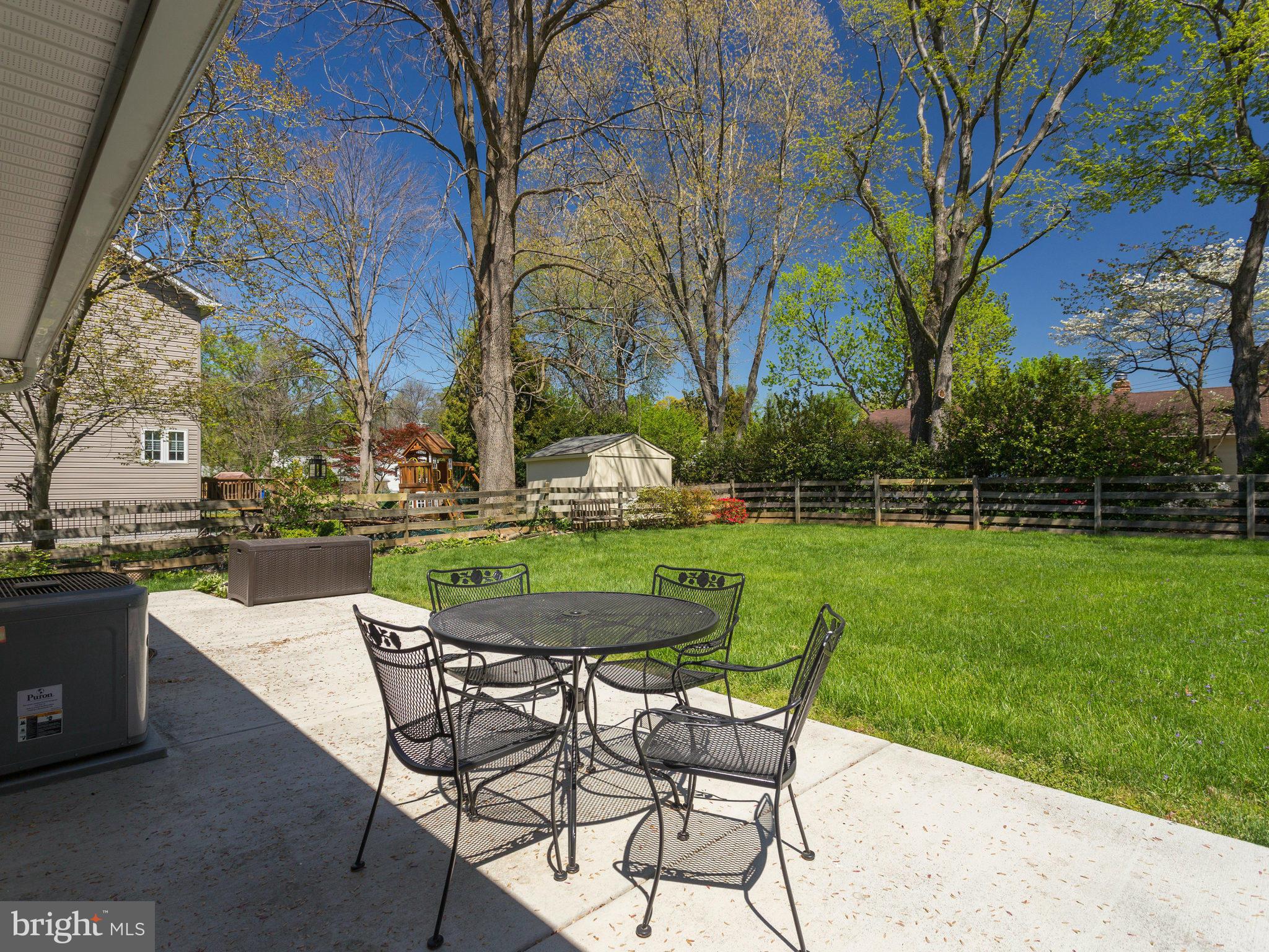 5218 Garner Street Springfield, VA 22151 - Photo 24 of 29 a view of a chairs and table in the garden