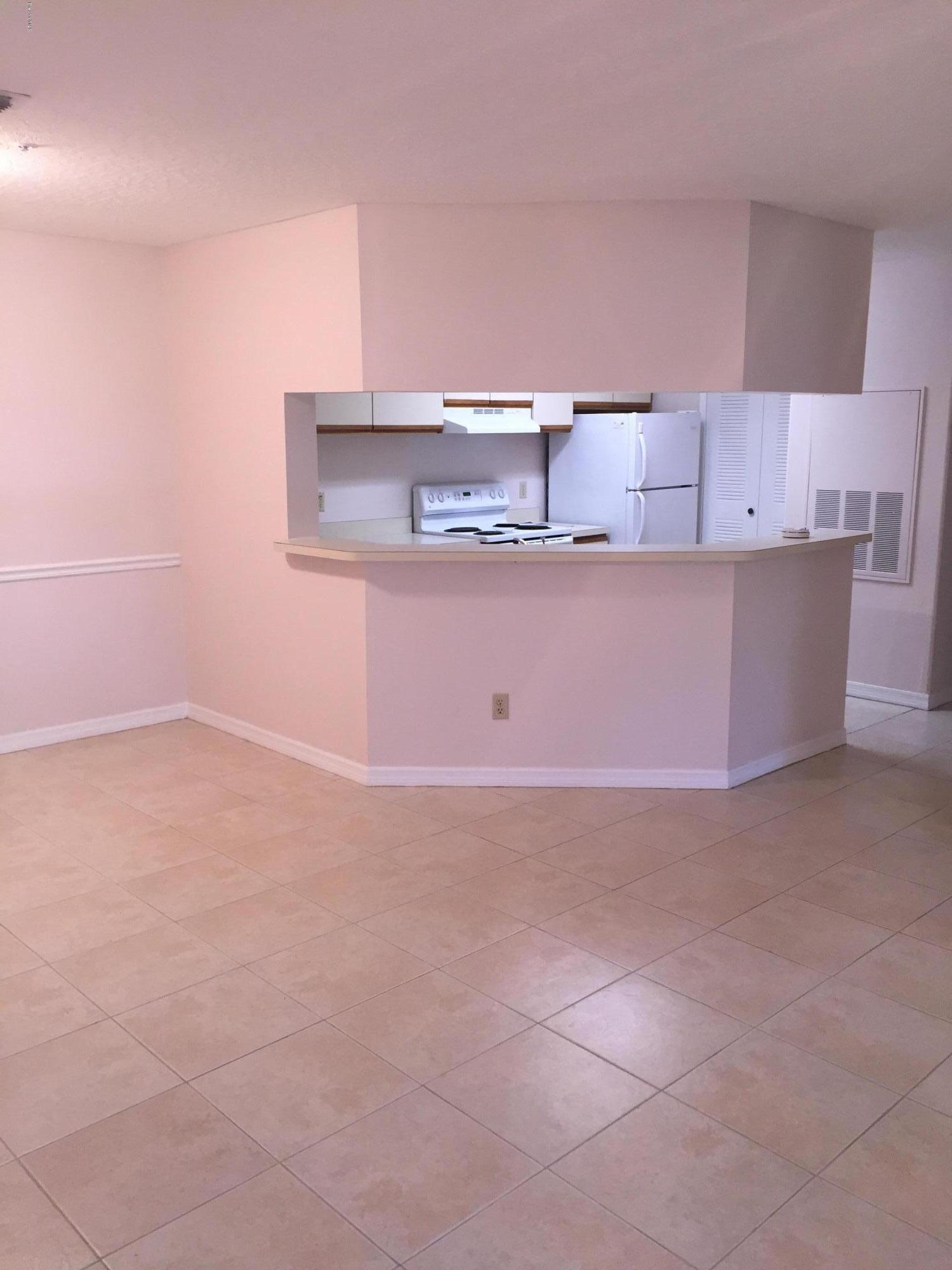 7667 North Wickham Road, Unit 101 Melbourne, FL 32940 - Photo 1 of 13 Open Living/ Dining