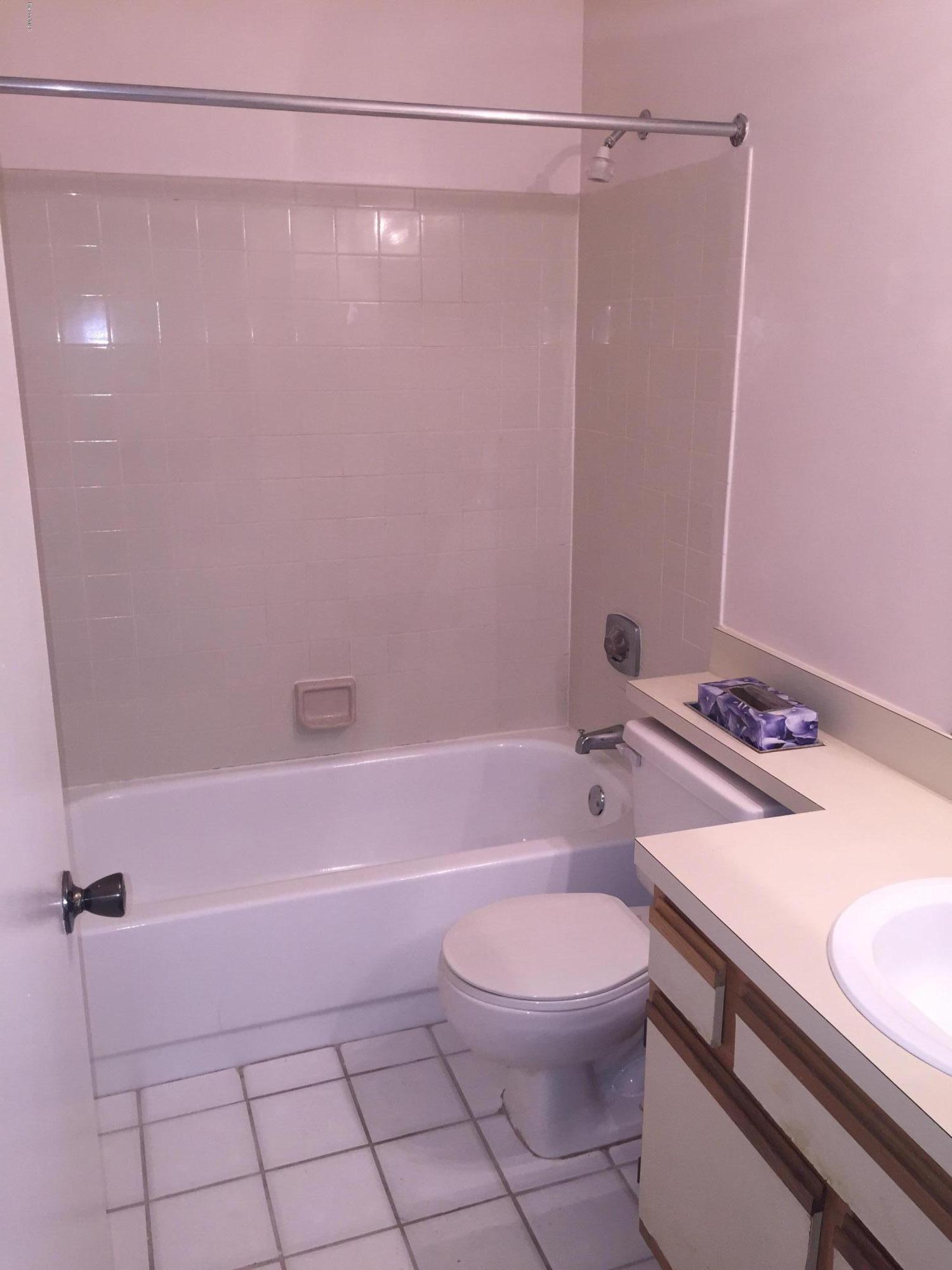 7667 North Wickham Road, Unit 101 Melbourne, FL 32940 - Photo 4 of 13 Guest Bath