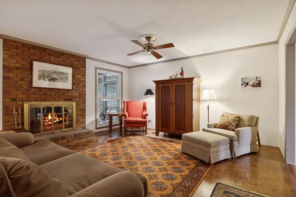 a bedroom with furniture and a fireplace