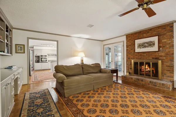 a living room with furniture and a fireplace