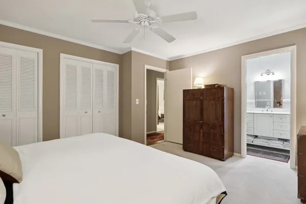 a bedroom with a bed and cabinets