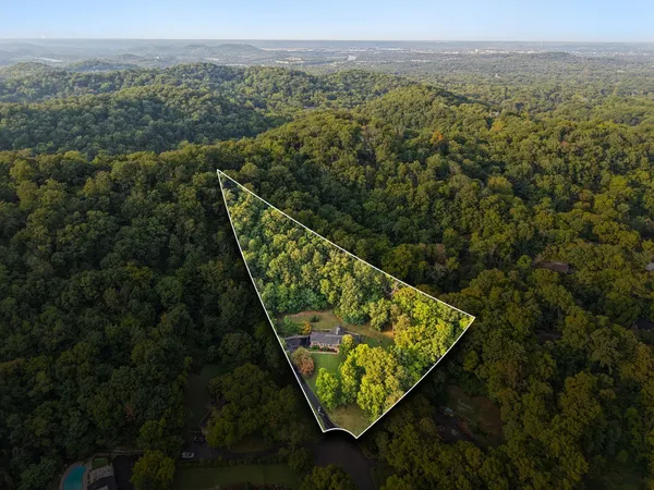 an aerial view of a house with a garden