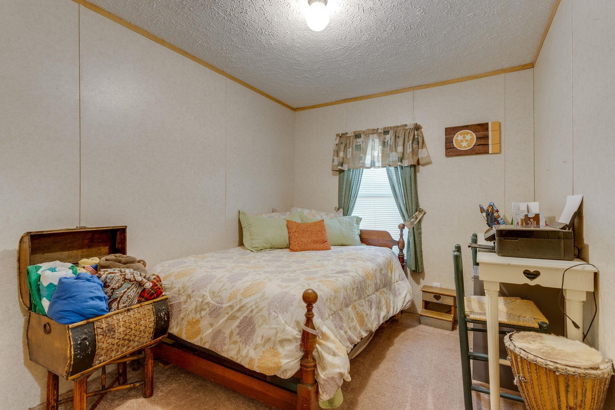204 Screamer Road Lynnville, TN 38472 - Photo 10 of 18 2nd Bedroom is 9x13 with Carpeted floor covers.