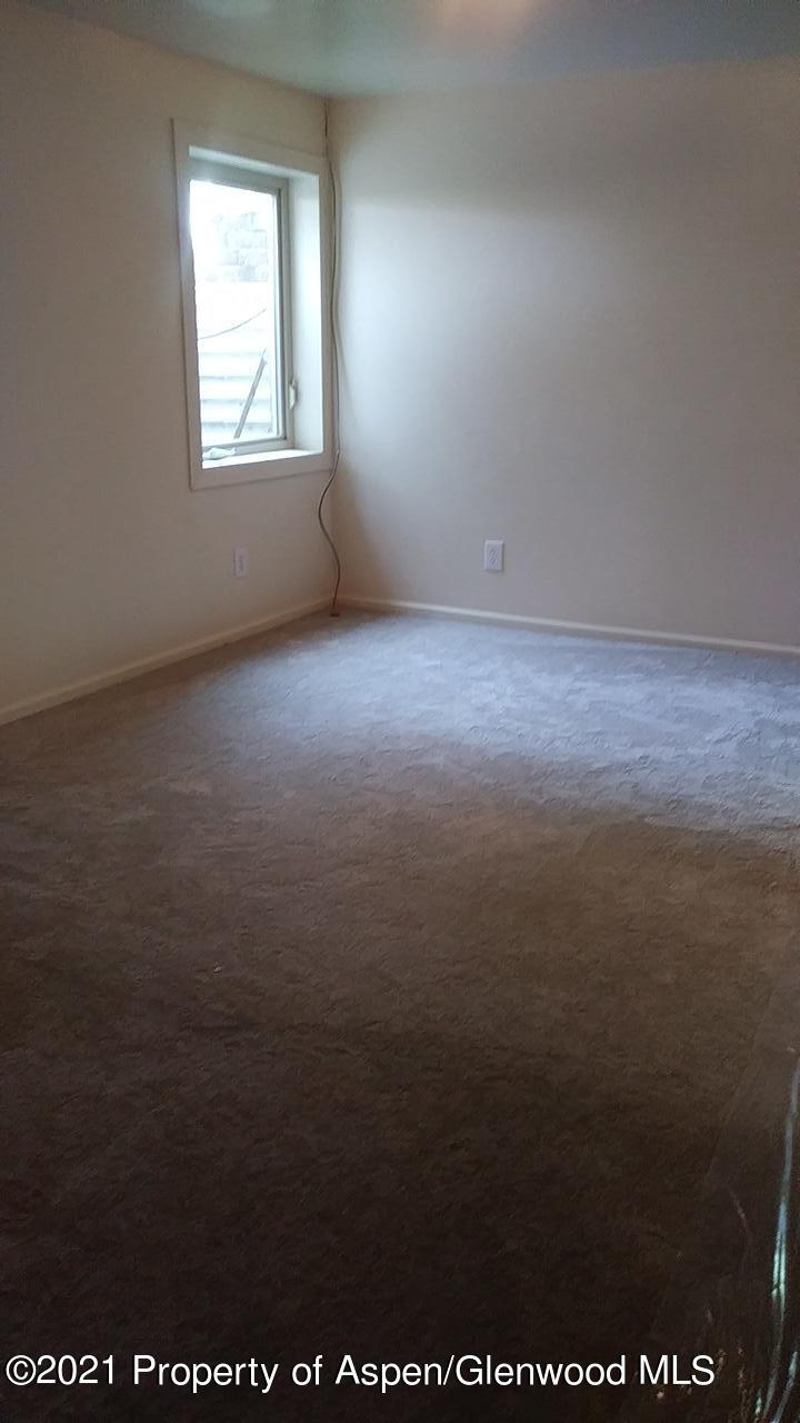 207 Ash Avenue Rifle, CO 81650 - Photo 12 of 21 an empty room with a window