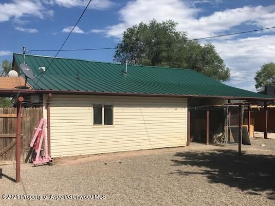 207 Ash Avenue Rifle, CO 81650 - Photo 21 of 21 a front view of a house with garage