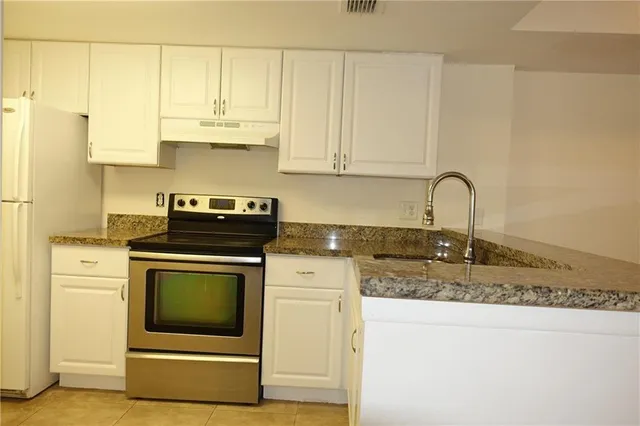a bathroom with a toilet a sink and a bathtub