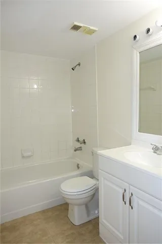 an empty room with windows and outdoor view