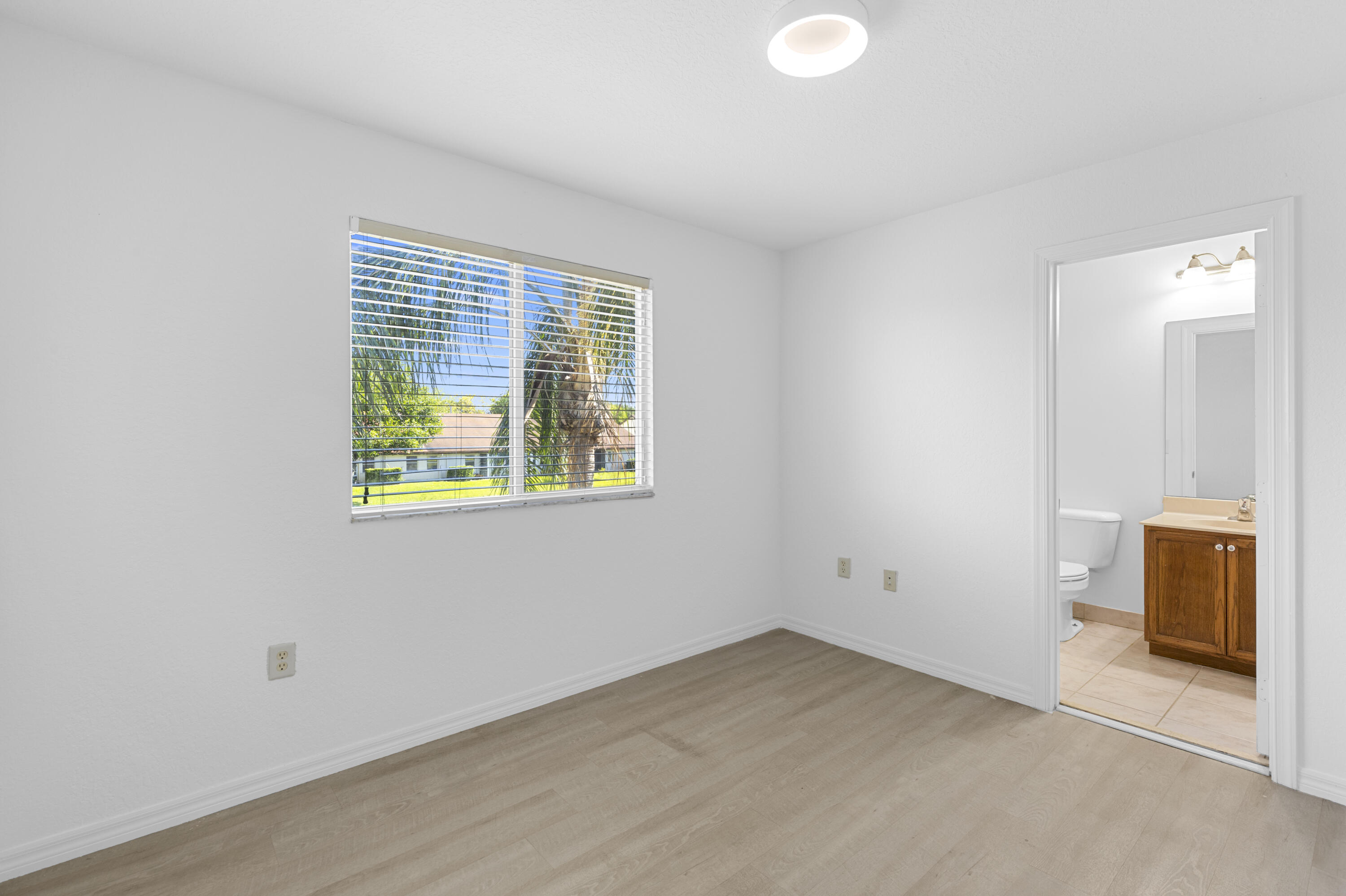 9107 Chambers Street, Unit 9107 Tamarac, FL 33321 - Photo 18 of 30 an empty room with a window
