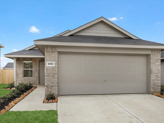 a front view of a house with garage