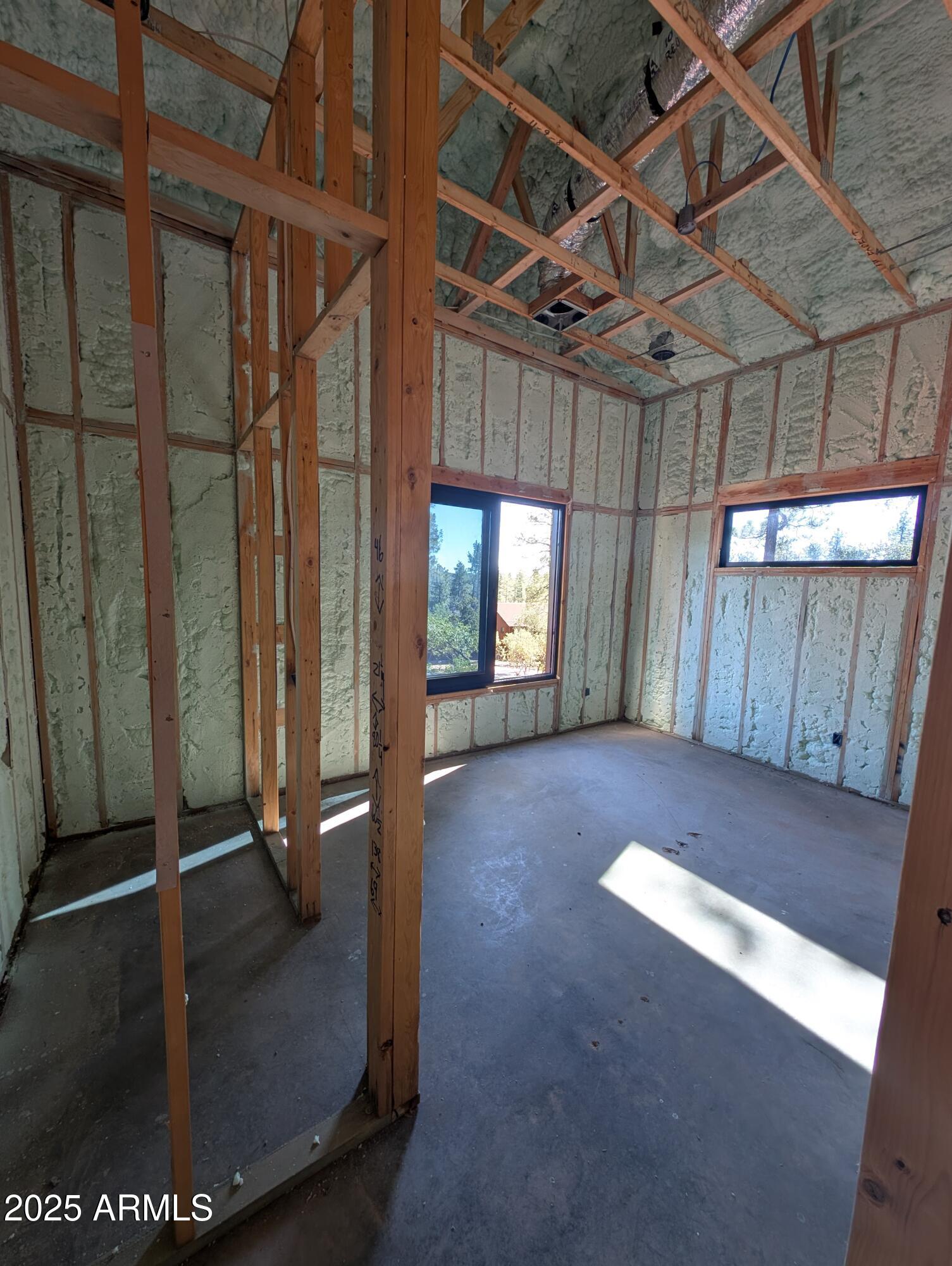 4165 West W Forest Pine, AZ 85544 - Photo 18 of 24 a view of a room with wooden floor and windows
