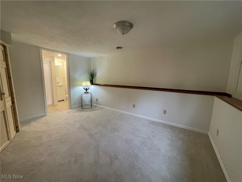 1984 Hebron Road St. Marys, WV 26170 - Photo 24 of 33 Lower Level Primary bedroom with light colored carpet and baseboards